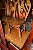 AN OAK DROP LEAF DINING TABLE and four wheel back chairs (5)