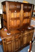 A PAIR OF PRIORY OAK TWO DOOR CABINETS, together with a matching sideboard (3)