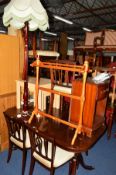 A MODERN MAHOGANY TWIN PEDESTAL DINING TABLE together with six chairs including two carvers, a