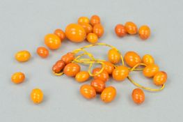 A SELECTION OF LOOSE NATURAL AMBER BEADS, of oval shape measuring 0.9 to 1.81mm, together with a