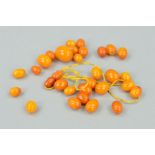 A SELECTION OF LOOSE NATURAL AMBER BEADS, of oval shape measuring 0.9 to 1.81mm, together with a
