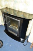 A BLACK DIMPLEX ELECTRIC FIRE PLACE