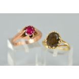 TWO GEM SET RINGS, the first a 9ct gold ring claw set with an oval smokey quartz, hallmarked, ring