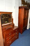 AN EDWARDIAN CARVED MAHOGANY PANELLED TWO DOOR WARDROBE above a single long drawer, width 144cm x