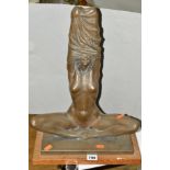 A BRONZED FIGURE OF A SEATED FEMALE NUDE, mounted on a rectangular oak base, approximate height