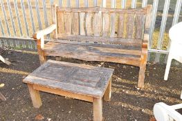 A GARDEN BENCH WITH STOOL