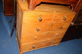 A VICTORIAN PINE CHEST of two short and three long drawers with various turned handles on bun