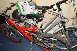A RED RALEIGH MOUNTAIN BIKE together with a woman's Raleigh voyager bike and two helmets (4)