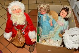 A FATHER CHRISTMAS, sat on a folding wooden chair, with a small quantity of modern plastic dolls