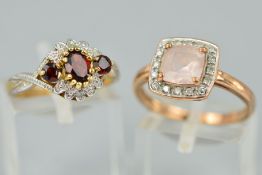 TWO 9CT GOLD GEM SET RINGS, the first a garnet and diamond dress ring, designed as an oval garnet