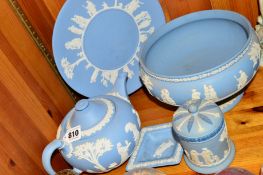 FIVE PIECES OF WEDGWOOD PALE BLUE JASPERWARE, including pedestal fruit bowl, teapot and box with