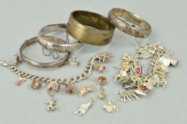 A SELECTION OF SILVER BANGLES AND A CHARM BRACELET to include a Smith & Pepper oval hinged bangle