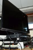 A PANASONIC 32' LED 32' TV with a Samsung DVD-R136 DVD recorder, a Panasonic DMR-EX83 Freeview