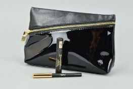 YVES ST LAURENT CLUTCH BAG IN BLACK WITH A YVES ST LAURENT EYE PENCIL