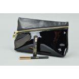 YVES ST LAURENT CLUTCH BAG IN BLACK WITH A YVES ST LAURENT EYE PENCIL