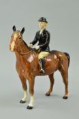 A BESWICK HUNTSWOMAN No 1730, on brown horse (head reglued)