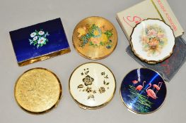 SIX COMPACTS to include two Stratton compacts, one with floral decoration and one depicting