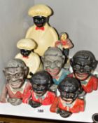 A COLLECTION OF JOLLY GENTLEMAN MONEY BOXES, three are cast iron (one missing base) and two are