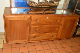 AN ERCOL ELM 1960'S SIDEBOARD, with three drawers central to two cupboards doors, approximate