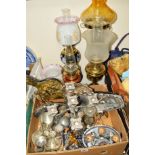A BOX OF METALWARES, two oil lamps and two table lamps of oil lamp style, all with chimneys and