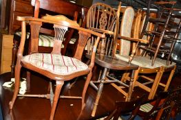 AN EDWARDIAN MAHOGANY AND INLAID CORNER CHAIR, an oak wheel back carver chair and two golden oak