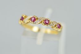 A 9CT GOLD RUBY AND DIAMOND RING designed as four circular rubies interspaced by tapered diagonal