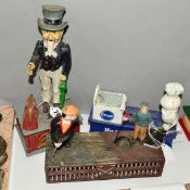 THREE REPRODUCTION CAST IRON MONEY BOXES, Uncle Sam, Golfers and the Pillsbury Dough Boy (3)