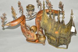 AN EASTERN BRASS INCENSE BURNER in the shape of a pitched roof house (s.d), with an Indian desk