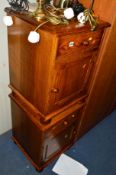 A PAIR OF GOLDEN OAK BEDSIDE CABINETS with a single drawer