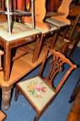 A SET OF FOUR GEORGIAN OAK DINING CHAIRS with needlework drop in seat pads