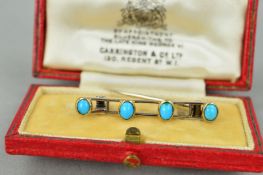 AN EARLY 20TH CENTURY TURQUOISE BAR BROOCH, four oval turquoise cabochons, brooch measuring