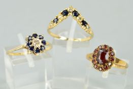 THREE DRESS RINGS comprising of a 9ct gold sapphire and diamond wishbone ring, a sapphire and