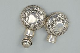 AN EDWARDIAN SILVER SCENT BOTTLE CASE OF CIRCULAR FORM, hinged covers, embossed floral decoration,