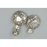 AN EDWARDIAN SILVER SCENT BOTTLE CASE OF CIRCULAR FORM, hinged covers, embossed floral decoration,