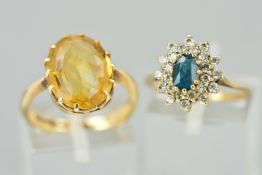 TWO 9CT GOLD RINGS, the first designed as an oval citrine within a claw setting, ring size M, the