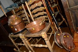 A VICTORIAN COPPER MILK CHURN, a brass jam pan and two warming pans