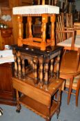A PRIORY OAK DROP LEAF TEA TROLLEY, another tea trolley, a similar nest of three tables, a stool and
