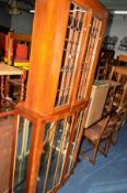 AN ART DECO WALNUT TWO DOOR CHINA CABINET (key), a glazed bookcase top, coffee table and a linen box