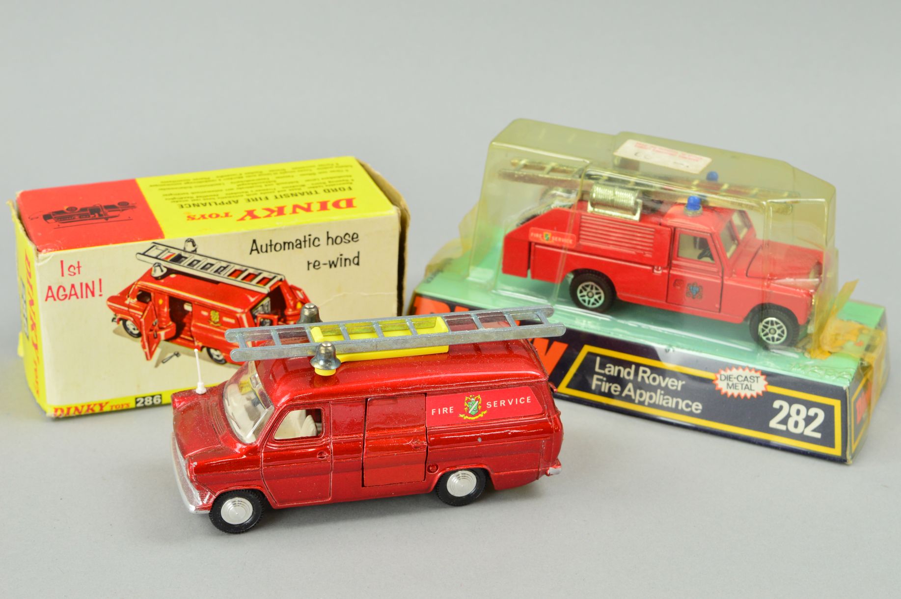 TWO BOXED DINKY TOY FIRE ENGINES, Land Rover No282, still sealed in original packaging, some