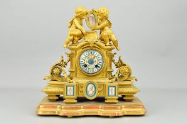 A LATE 19TH CENTURY FRENCH GILT METAL AND PORCELAIN FIGURAL MANTEL CLOCK BY JAPY FRERES, the