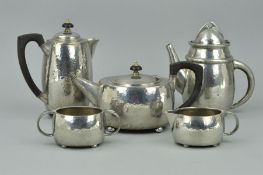 A LIBERTY & CO TUDRIC PEWTER COFFEE POT, after a design by Archibald Knox, stamped 0232 to the base,