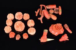 A SELECTION OF LOOSE CORAL PIECES, to include Victorian carved coral hand grasping a dagger, a