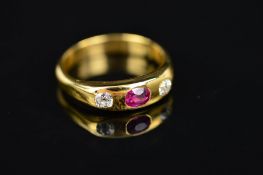 AN EARLY 20TH CENTURY RUBY AND DIAMOND THREE STONE RING, one oval mixed ruby, two Old European cut