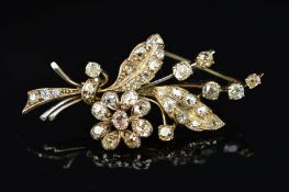 AN OLD EUROPEAN FLORAL AND FOLIATE DESIGN DIAMOND SPRAY BROOCH, measuring approximately 57mm in