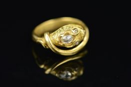 A GOLD DIAMOND SNAKE RING, the ring designed as a snake, the head with engraved scale detail and set