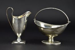 A GEORGE III SILVER PEDESTAL SUGAR BASKET, of oval form, beaded rims, swing handle, maker Soloman