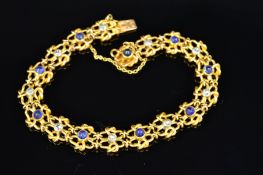 A GOLD EDWARDIAN FRENCH, CABOCHON CUT SAPPHIRE AND DIAMOND FANCY PANEL LINK BRACELET, estimated