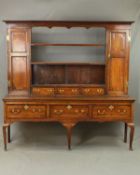 A GEORGE III OAK AND MAHOGANY BANDED DRESSER, the upper section with moulded cornice and wavy frieze