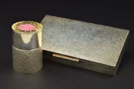 AN ELIZABETH II SILVER AND SILVER GILT TABLE LIGHTER, of cylindrical form, the pull off cover