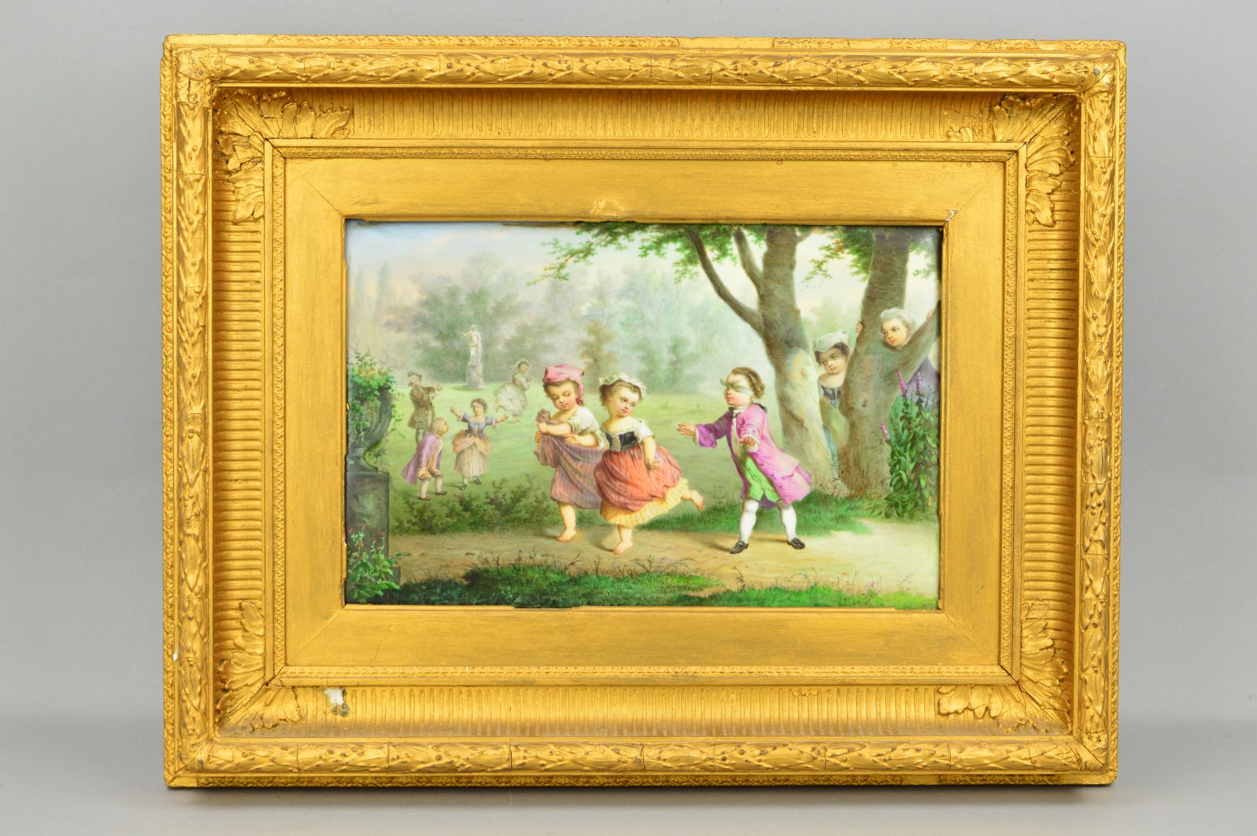 A 19TH CENTURY RECTANGULAR PORCELAIN PLAQUE, painted with children in mid/late 18th Century